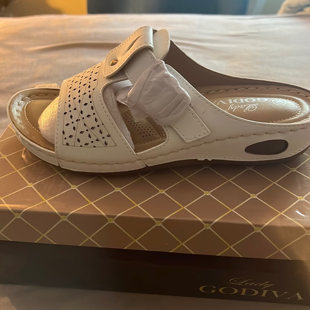 Lady Godiva white perforated buckle accent